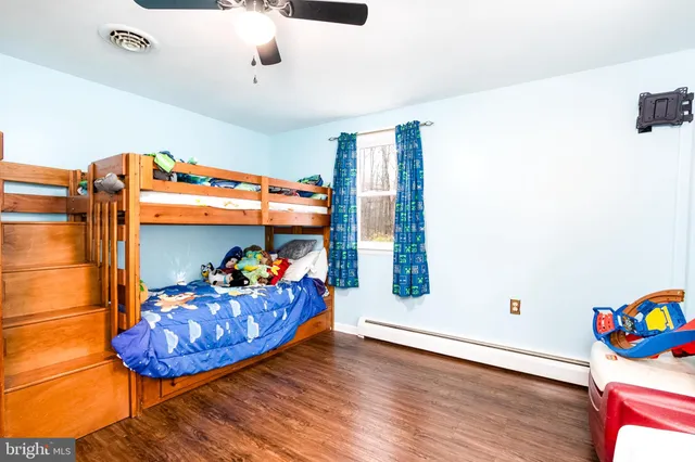 a view of a room with toys and wooden floor