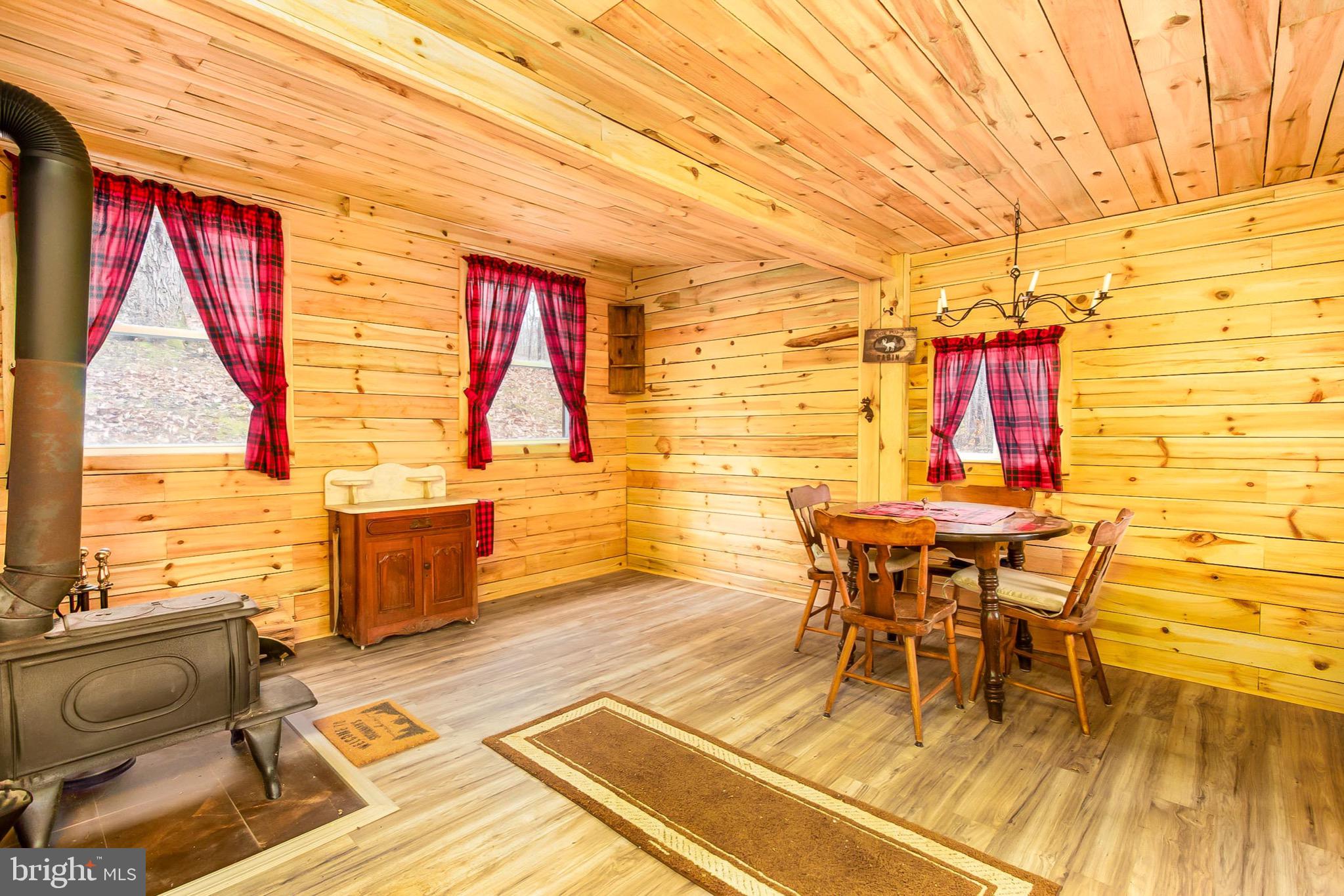 355 Silver Run Valley Road Westminster, MD 21158 - Photo 34 of 49 a dining room with furniture and wooden floor