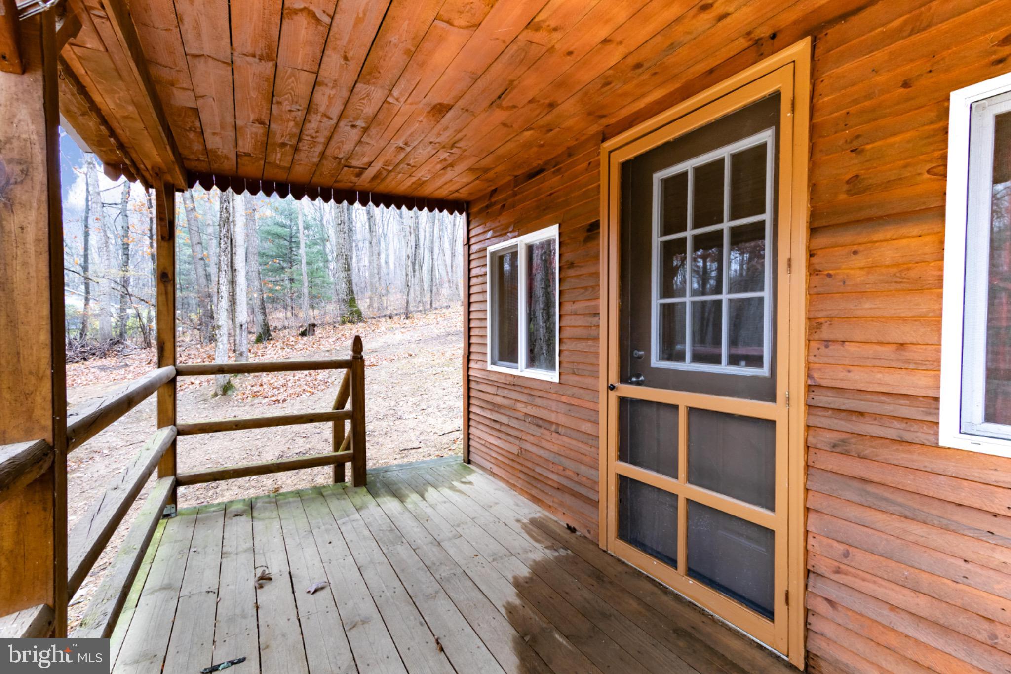 355 Silver Run Valley Road Westminster, MD 21158 - Photo 35 of 49 a view of a balcony with wooden floor and iron stairs