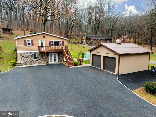 a house with yard and garage