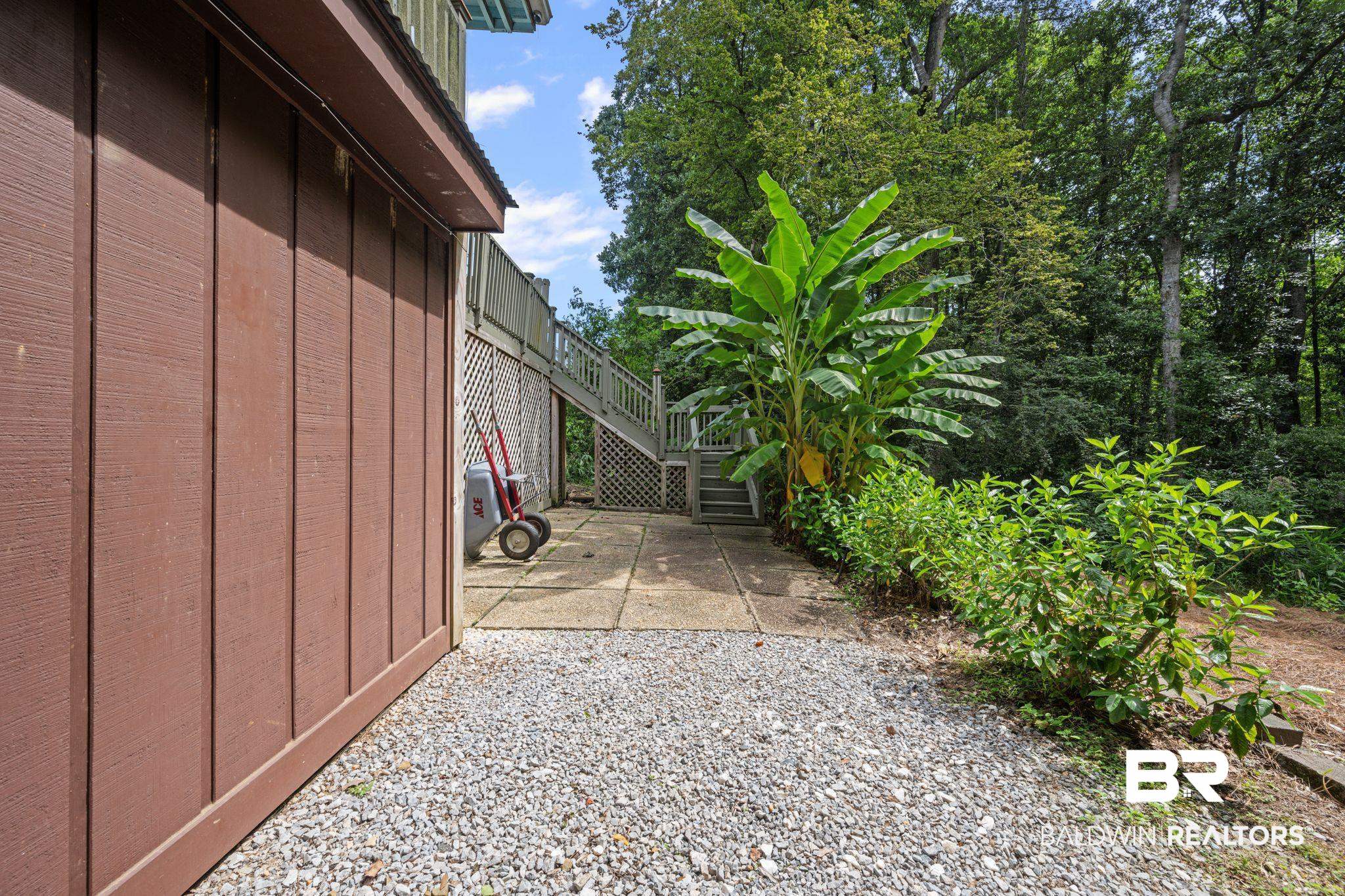 40 Caisson Trace Daphne, AL 36527 - Photo 39 of 54 View of yard with a covered patio area.