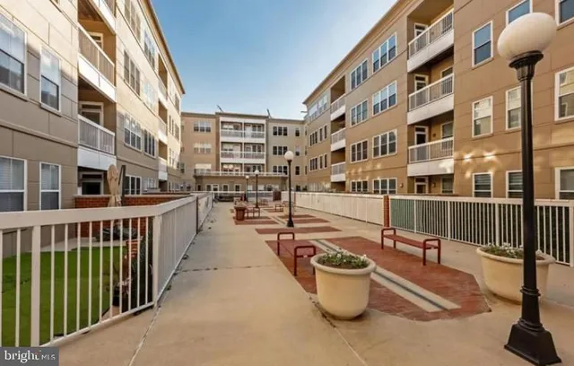 a view of a building with sitting area