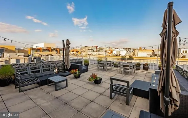 a view of a terrace with seating area