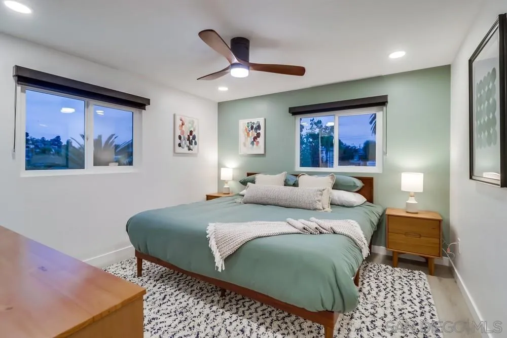 4584 3rd Street La Mesa, CA 91941 - Photo 11 of 57 a bedroom with a bed and a painting on the wall