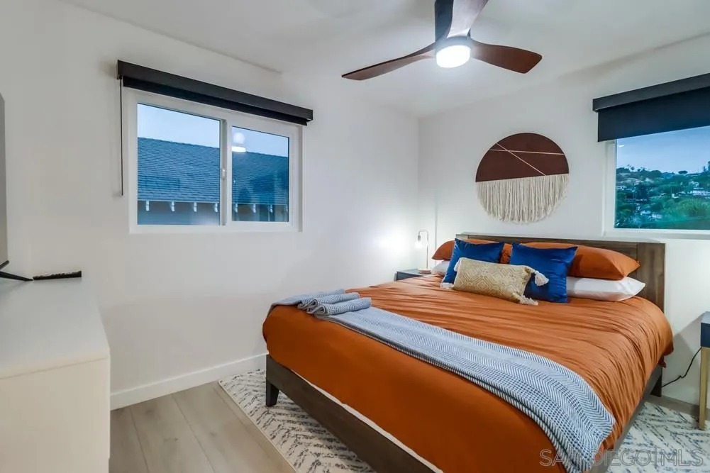 4584 3rd Street La Mesa, CA 91941 - Photo 14 of 57 a bedroom with a bed and a painting on the wall