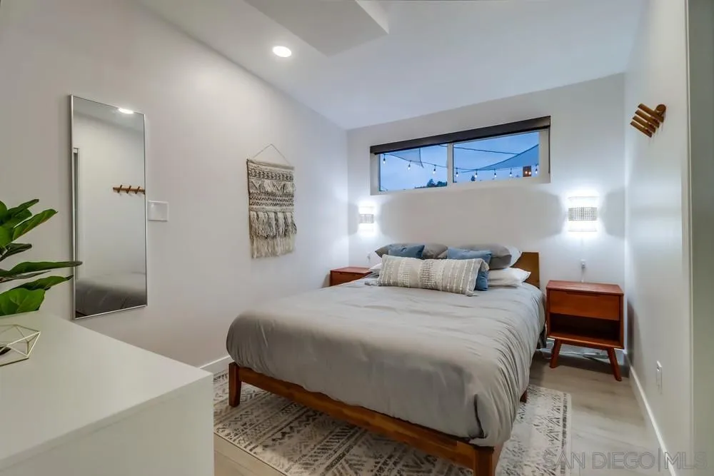 4584 3rd Street La Mesa, CA 91941 - Photo 27 of 57 a bedroom with a bed and a table