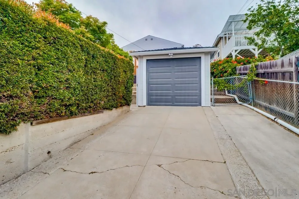4584 3rd Street La Mesa, CA 91941 - Photo 42 of 57 a view of a house with a small yard and wooden fence