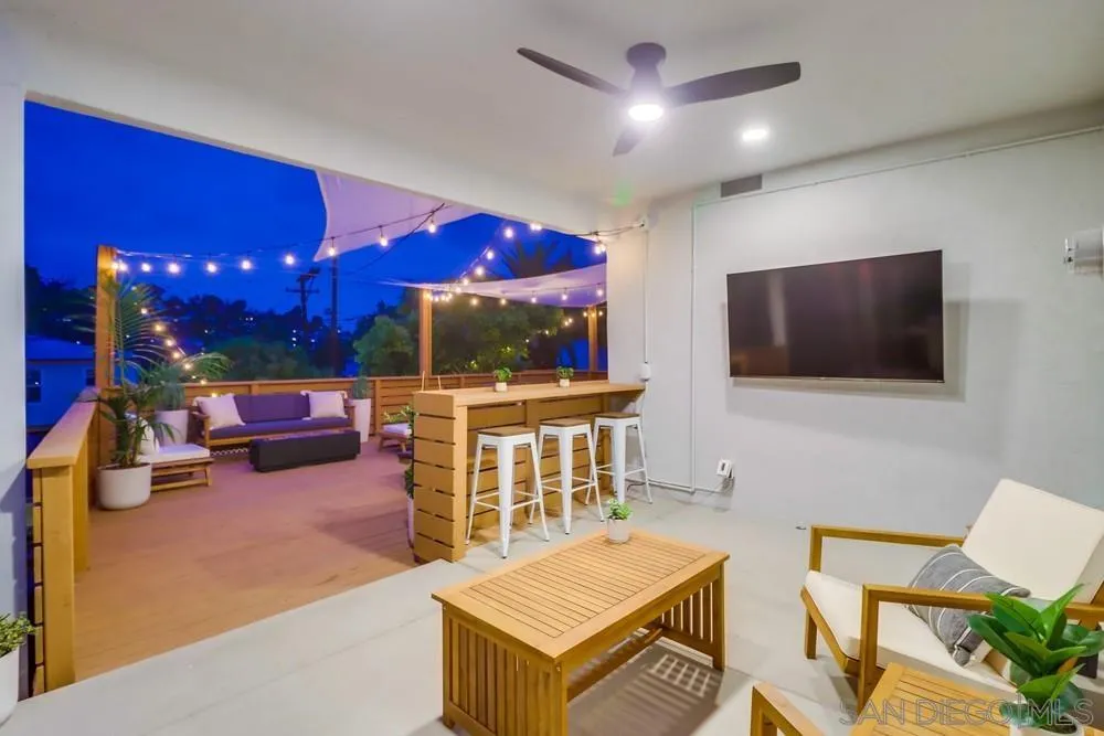 4584 3rd Street La Mesa, CA 91941 - Photo 53 of 57 a living room with furniture and a flat screen tv