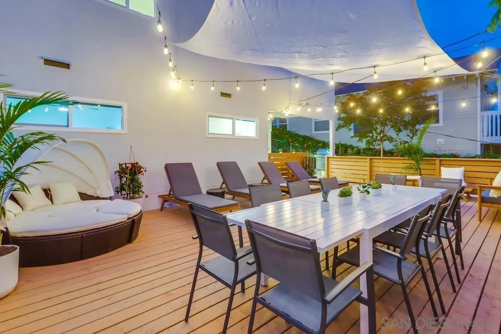 4584 3rd Street La Mesa, CA 91941 - Photo 55 of 57 a view of a patio with dining table and chairs with a barbeque grill and couches