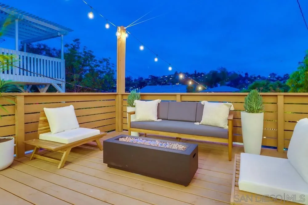 4584 3rd Street La Mesa, CA 91941 - Photo 56 of 57 a outdoor sitting area with a couch and wooden floor