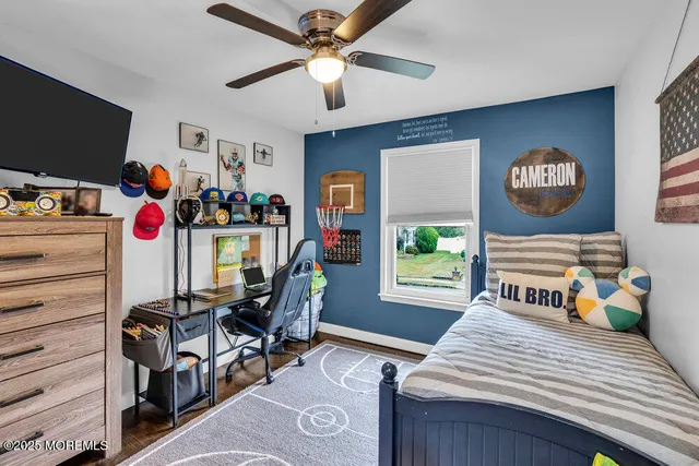 a bedroom with furniture and a window