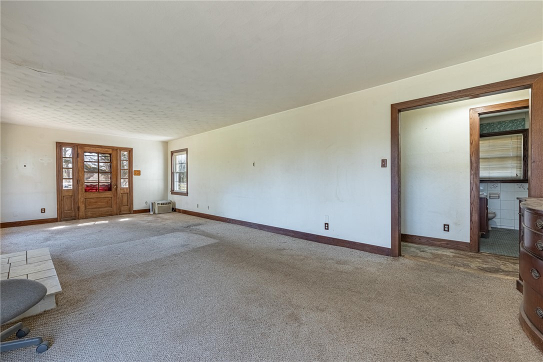 6885 Garber Road Clayton, OH 45415 - Photo 4 of 24 This spacious living area features classic design elements, a charming entryway, and ample natural light.