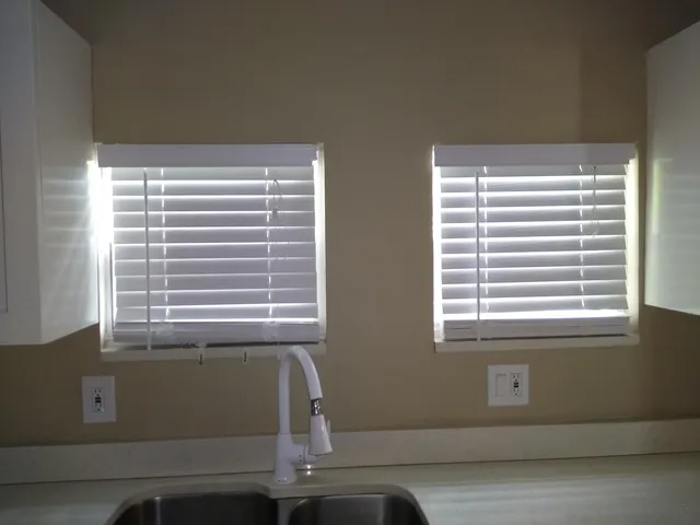 a room with a window and a chair