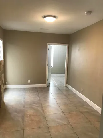 an empty room with a bathroom