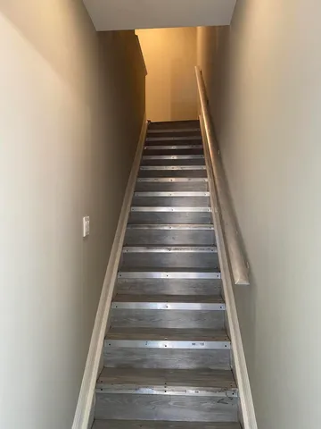 a kitchen with white cabinets and appliances
