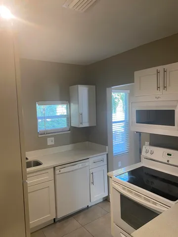 a bathroom with a sink a vanity and a window
