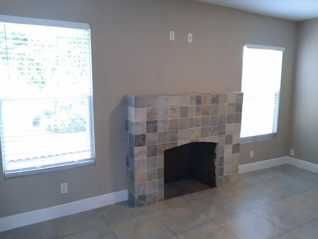 a room with fireplace and a window