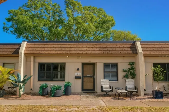 a house with a tree in front of it