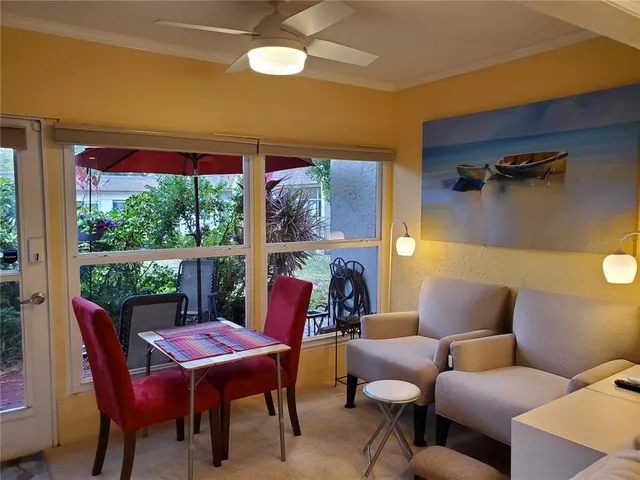 a view of a dining room with furniture window and outside view