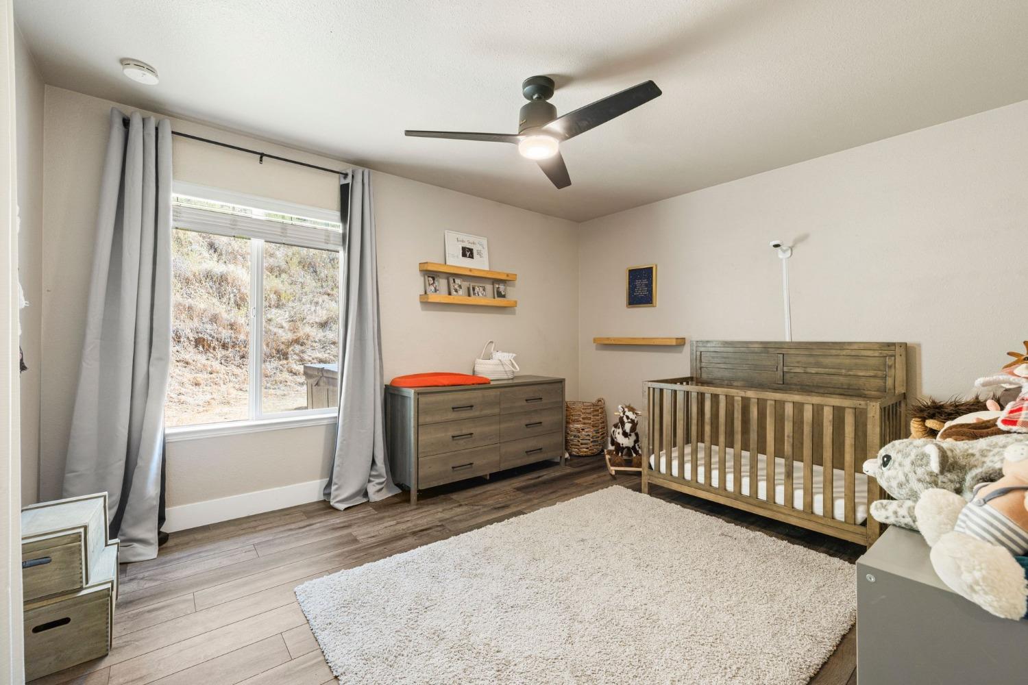 4842 Northern Lights Road Placerville, CA 95667 - Photo 16 of 26 a bedroom with furniture and a window