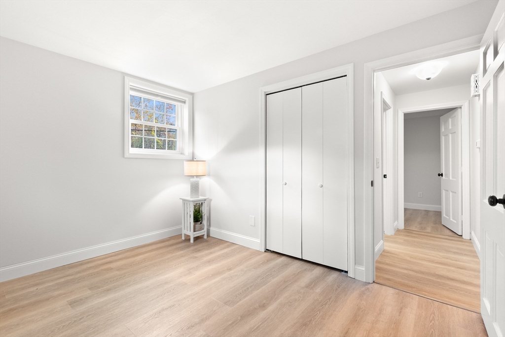 37 Holten Street, Unit 2 Danvers, MA 01923 - Photo 16 of 30 an empty room with wooden floor and a window