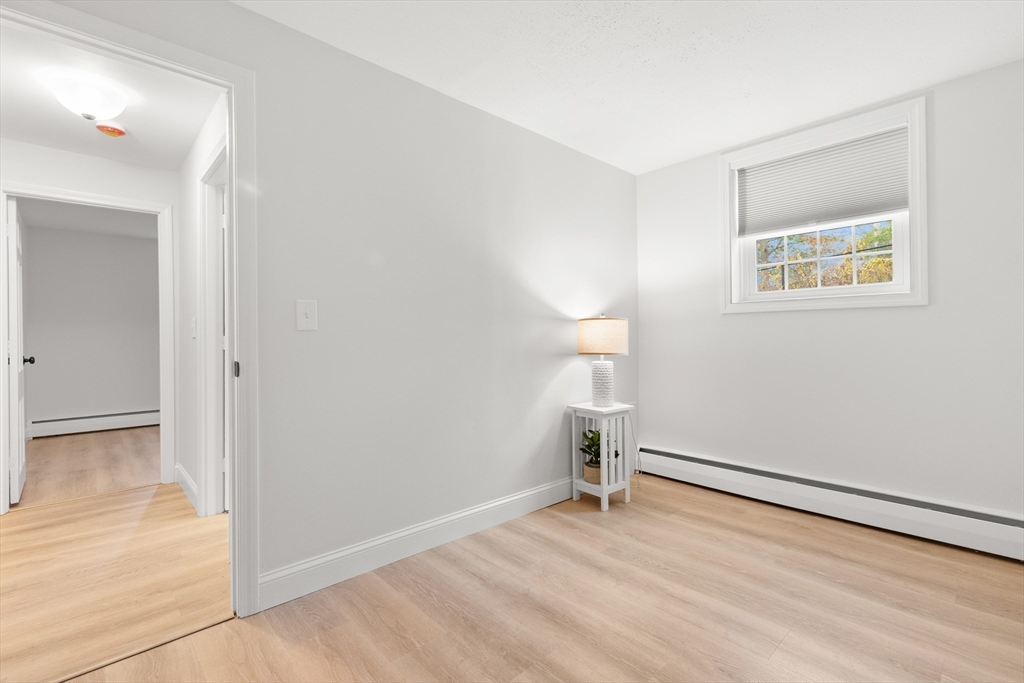 37 Holten Street, Unit 2 Danvers, MA 01923 - Photo 21 of 30 a view of empty room with wooden floor