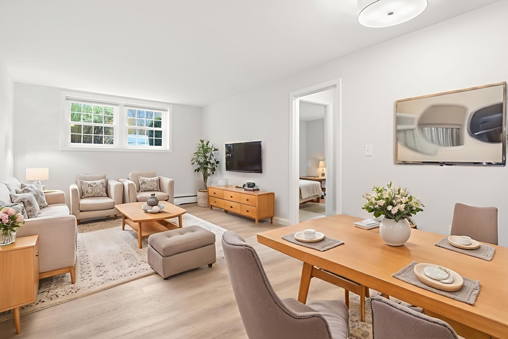 37 Holten Street, Unit 2 Danvers, MA 01923 - Photo 5 of 30 a living room with furniture and a flat screen tv