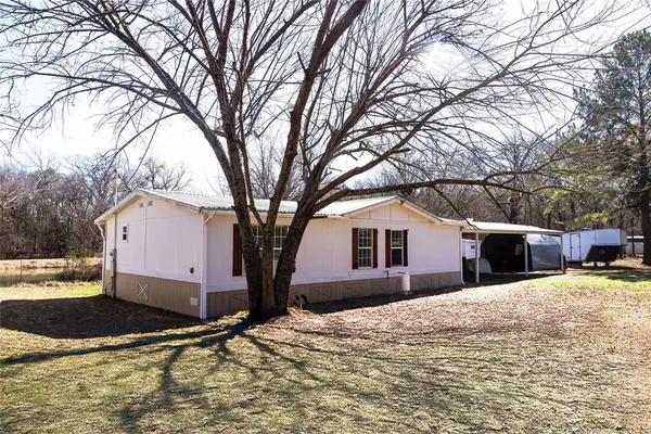 a view of a house with snow in the background