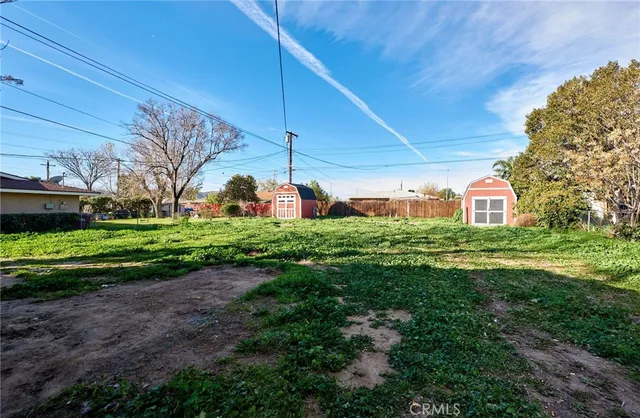 an empty room with closet and windows