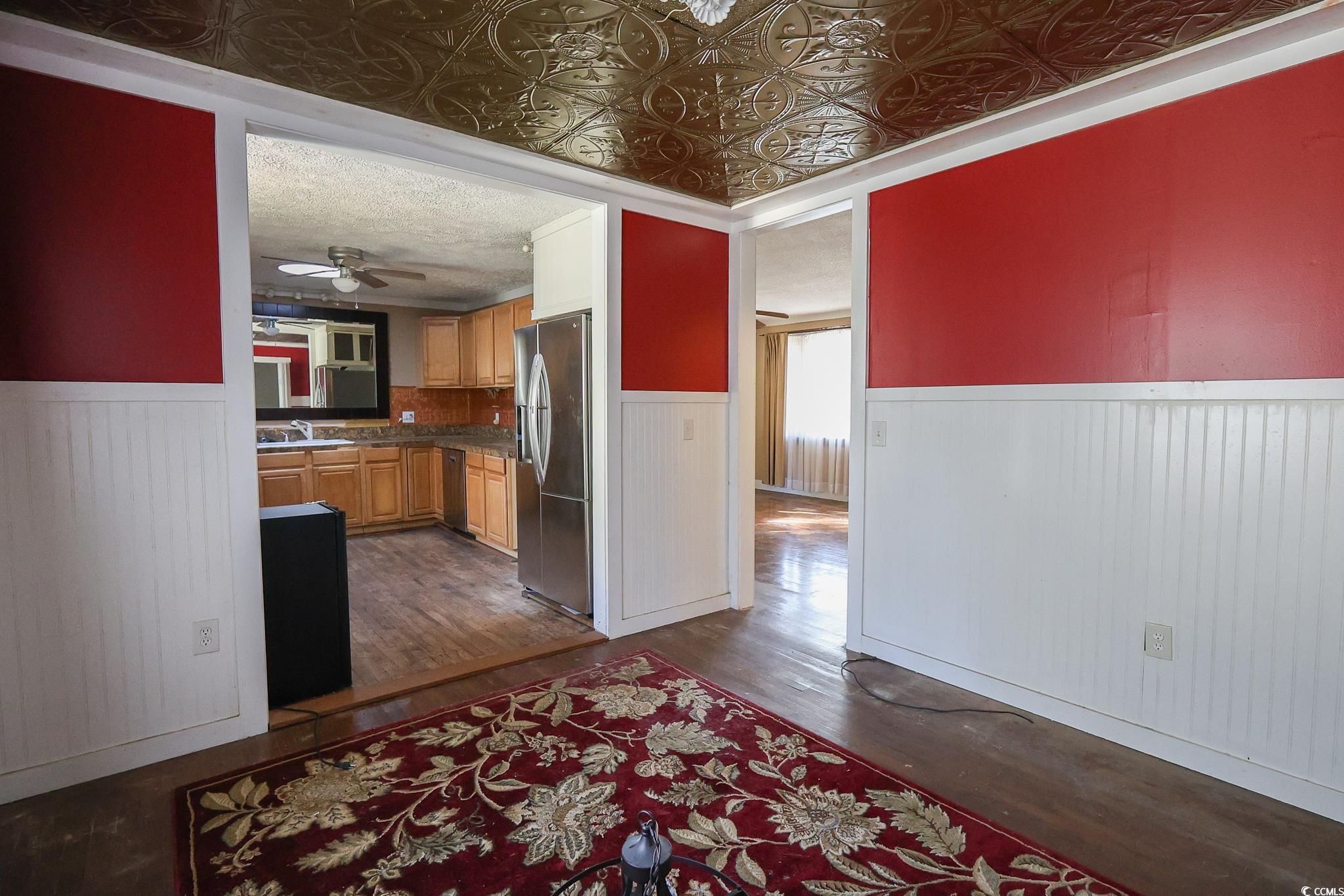 1841 Jasper Street Georgetown, SC 29440 - Photo 11 of 33 Kitchen featuring sink, a textured ceiling, dark hardwood / wood-style floors, ceiling fan, and stainless steel appliances