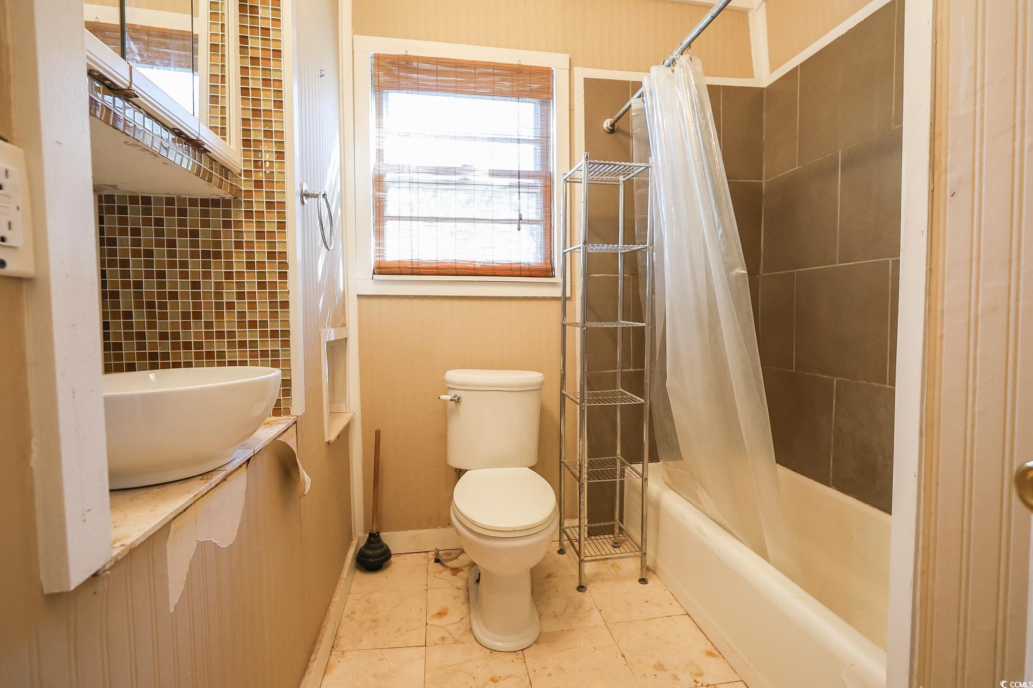 1841 Jasper Street Georgetown, SC 29440 - Photo 19 of 33 Bathroom with tile patterned flooring, shower / tub combo with curtain, and toilet