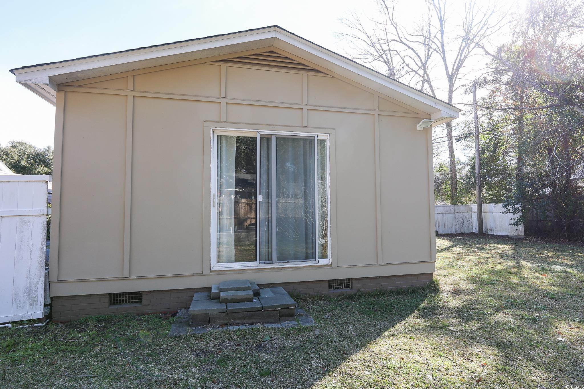 1841 Jasper Street Georgetown, SC 29440 - Photo 29 of 33 View of side of property with a yard