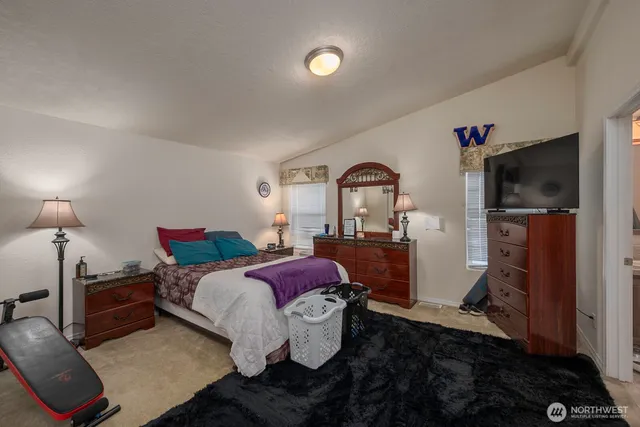 a bed room with a bed and a window