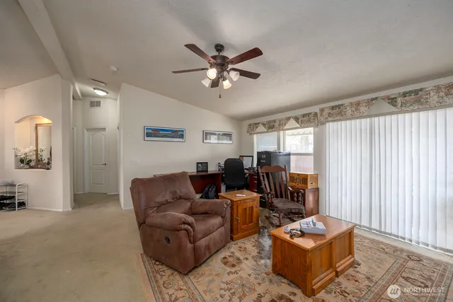 a living room with furniture and a window