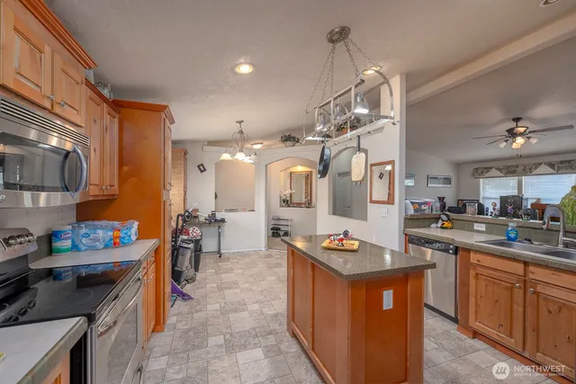 a kitchen with lots of counter top space and appliances