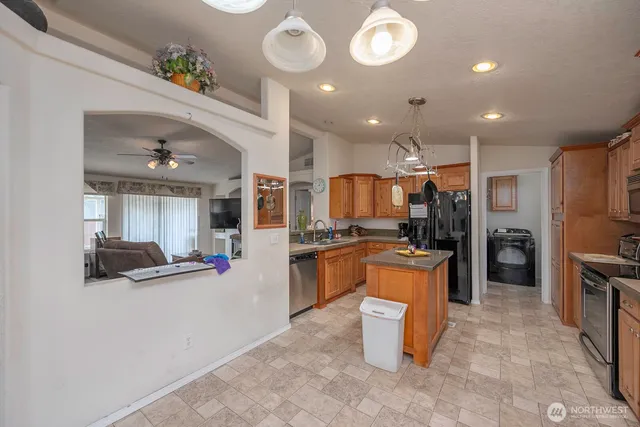 a kitchen with a refrigerator and a sink