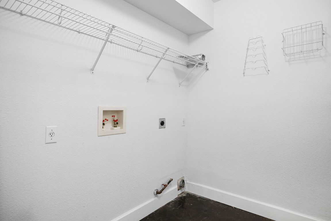 1886 Wallin Loop Round Rock, TX 78664 - Photo 14 of 28 a view of a room with racks on the wall