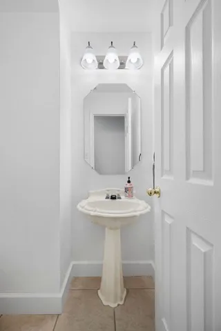 a view of a livingroom with a ceiling fan and window
