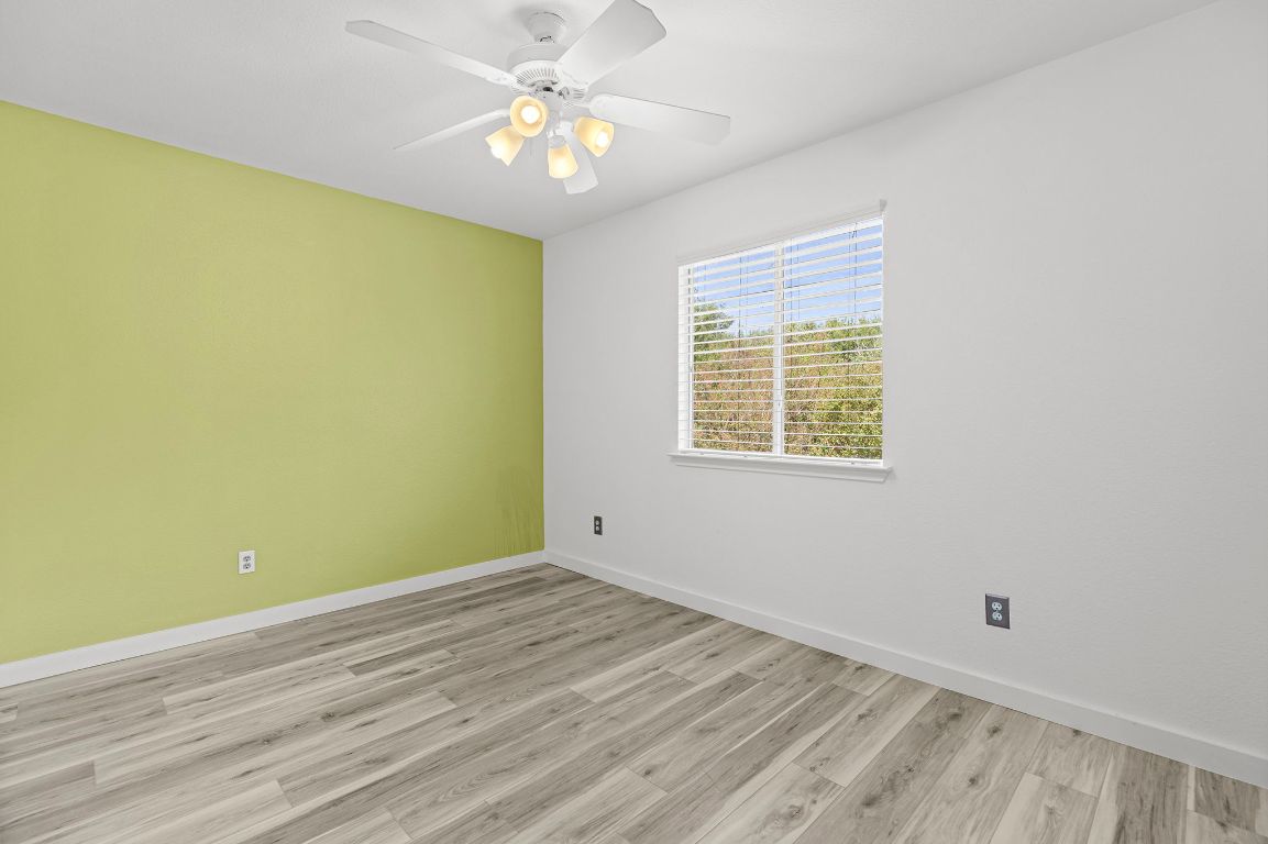 1886 Wallin Loop Round Rock, TX 78664 - Photo 18 of 28 wooden floor in an empty room with a window