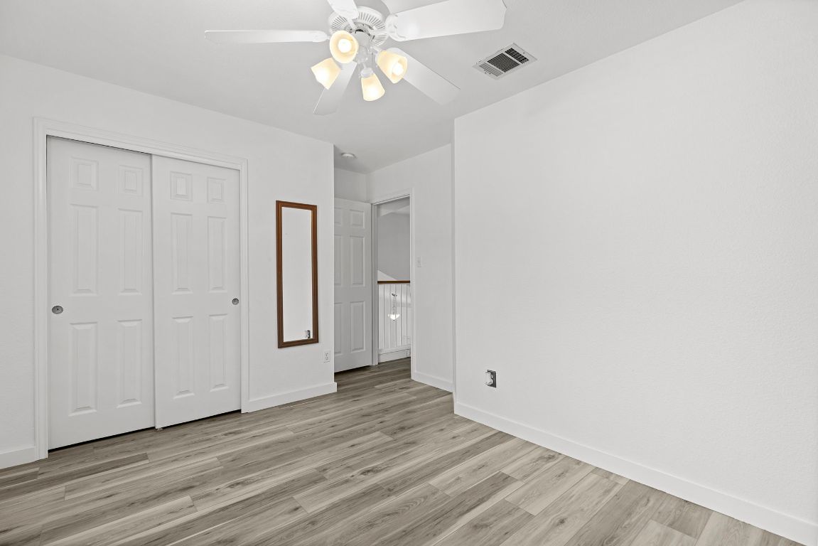 1886 Wallin Loop Round Rock, TX 78664 - Photo 19 of 28 a view of an empty room with wooden floor