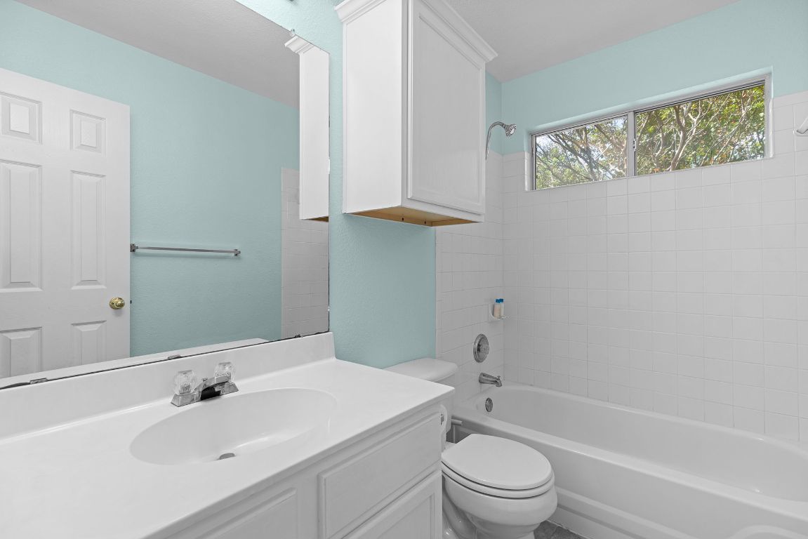 1886 Wallin Loop Round Rock, TX 78664 - Photo 20 of 28 a bathroom with a sink toilet and shower