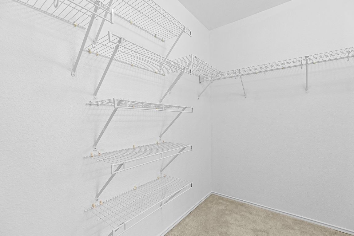 1886 Wallin Loop Round Rock, TX 78664 - Photo 24 of 28 a view of a room with racks on the wall