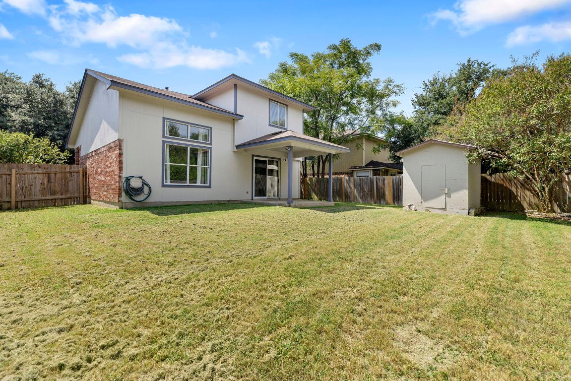 1886 Wallin Loop Round Rock, TX 78664 - Photo 26 of 28 a front view of a house with a yard and garage