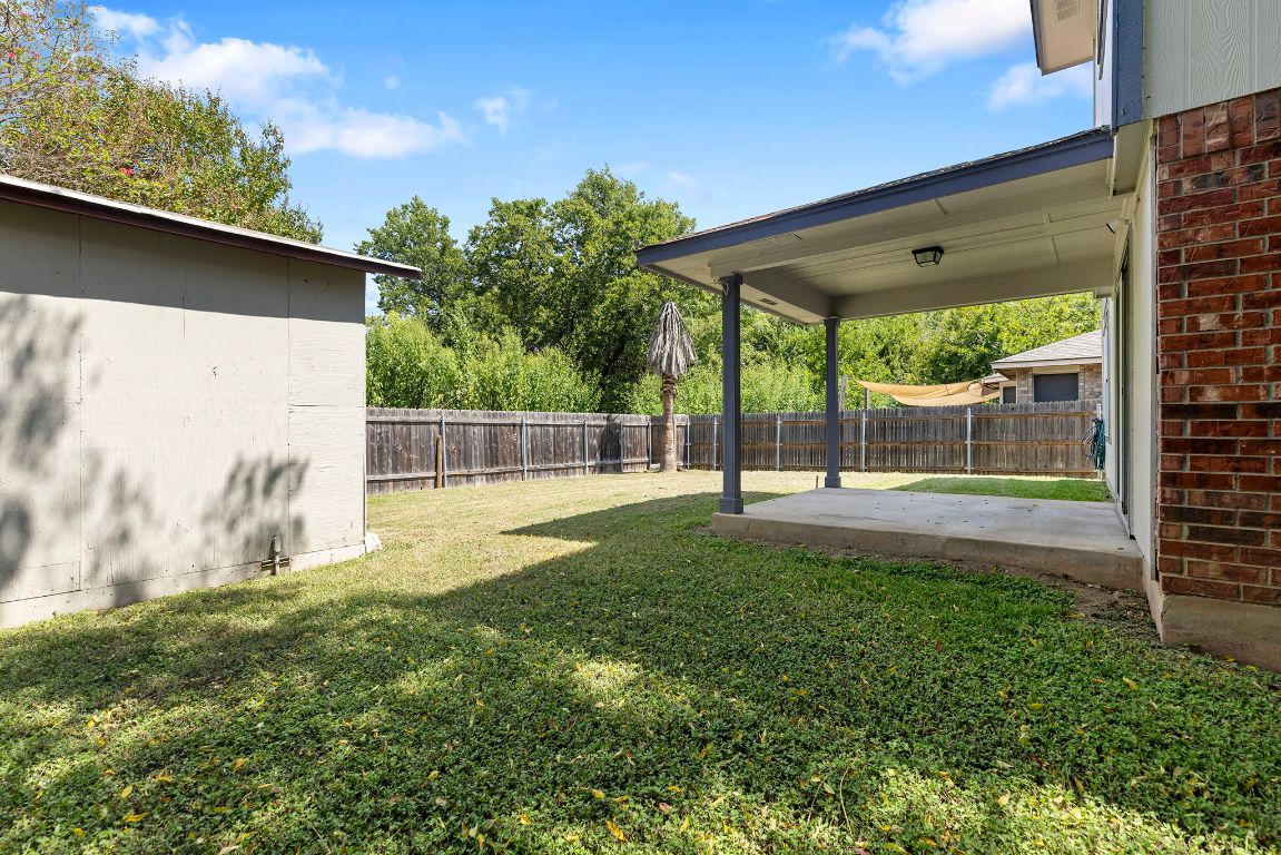 1886 Wallin Loop Round Rock, TX 78664 - Photo 27 of 28 a view of backyard with a garden and plants