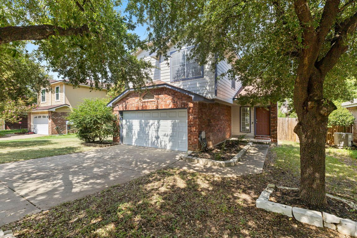 1886 Wallin Loop Round Rock, TX 78664 - Photo 4 of 28 a front view of a house with a yard