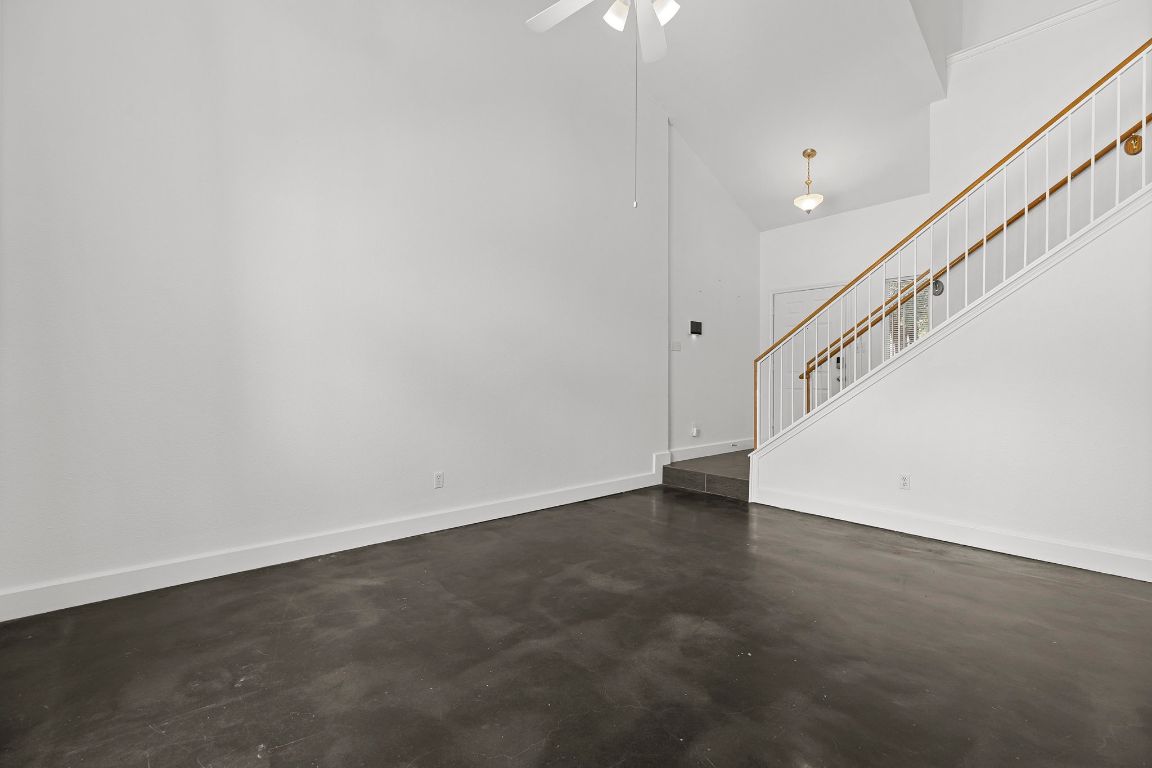 1886 Wallin Loop Round Rock, TX 78664 - Photo 9 of 28 a view of an empty room with stairs