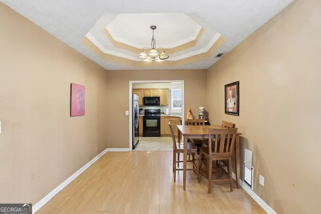 a view of a dining room with furniture