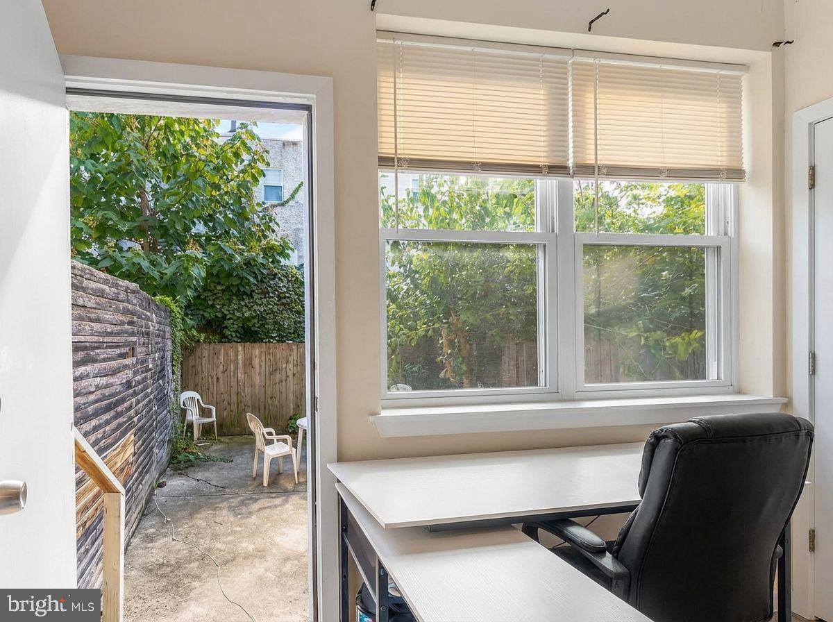1724 Monument Street, Unit B Philadelphia, PA 19121 - Photo 12 of 26 a view of a workspace with a window and chair