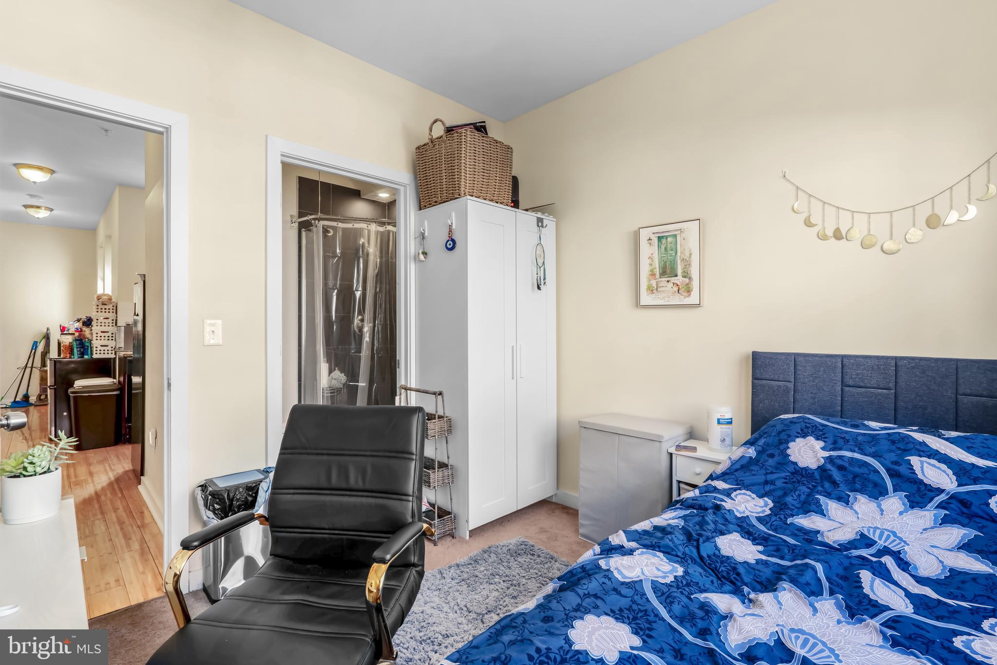 1724 Monument Street, Unit B Philadelphia, PA 19121 - Photo 7 of 26 a bedroom with furniture and wooden floor