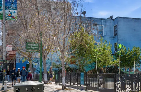a view of a building with a tree